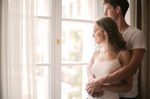 Newly weds looking out their window